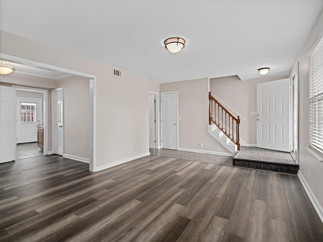 foyer entrance with dark wood-type flooring