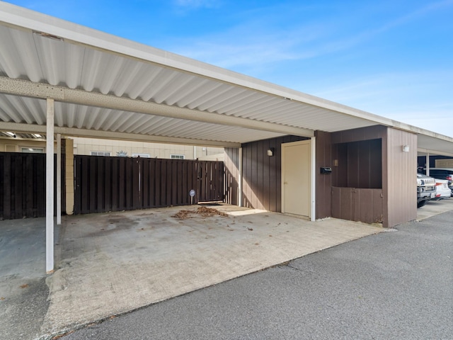 view of vehicle parking featuring a carport