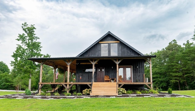 view of front of home featuring french doors and a front yard