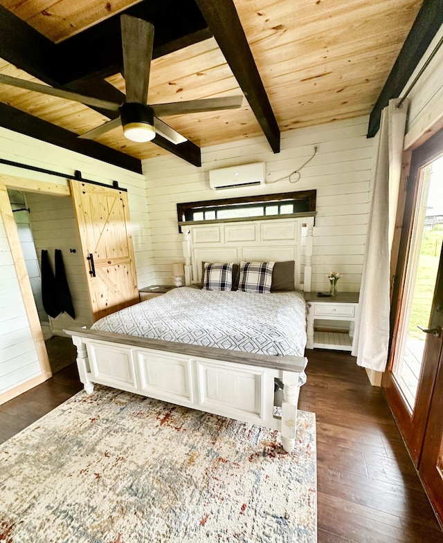 bedroom with a wall mounted air conditioner, wood walls, a barn door, beamed ceiling, and dark hardwood / wood-style flooring