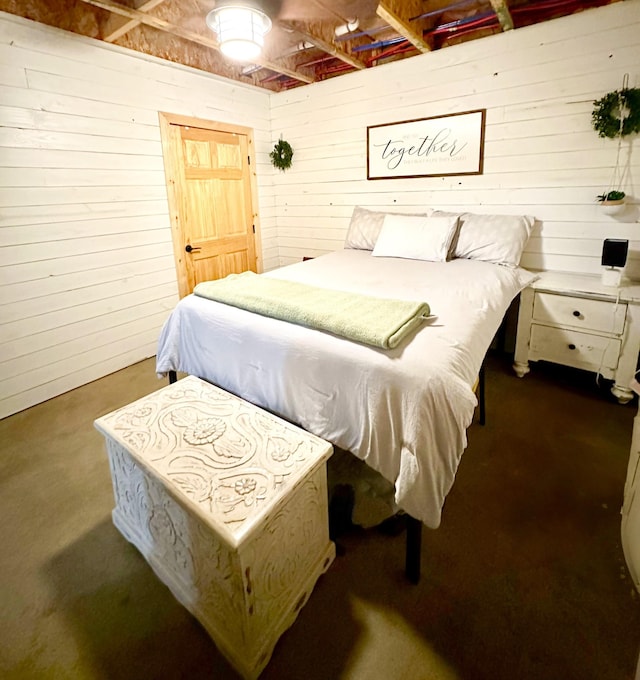 bedroom with wooden walls