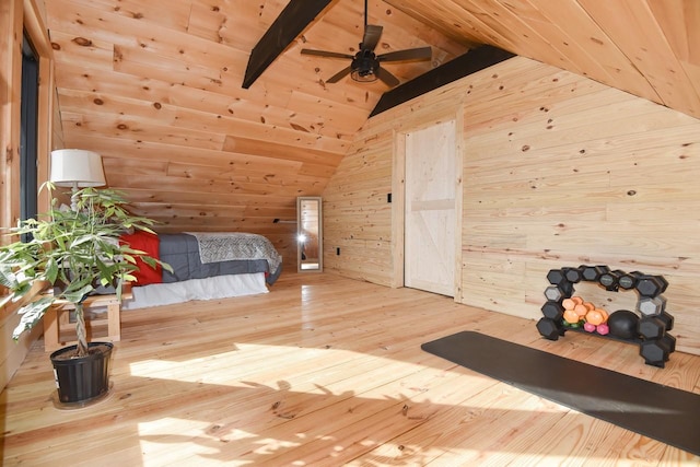 unfurnished bedroom with wood-type flooring, vaulted ceiling with beams, wood walls, and wood ceiling