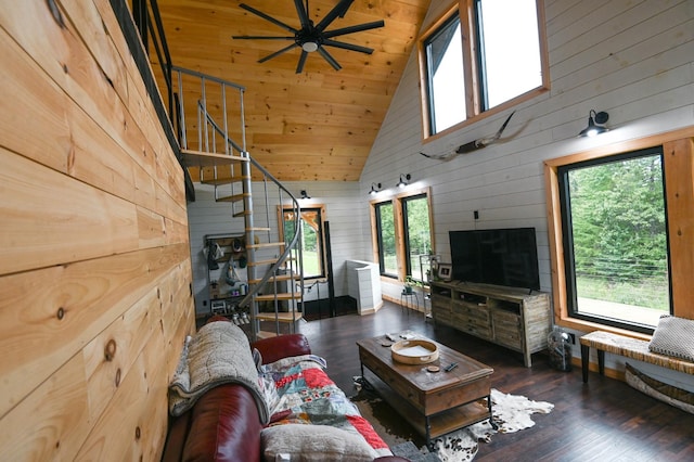 living room with wood walls, dark hardwood / wood-style flooring, high vaulted ceiling, and wood ceiling