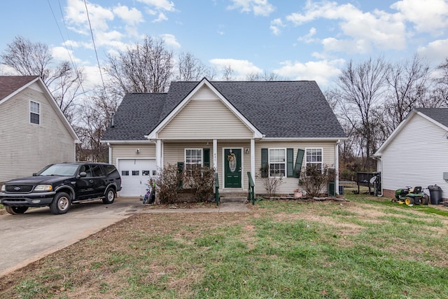 view of front of house featuring a front yard and a garage