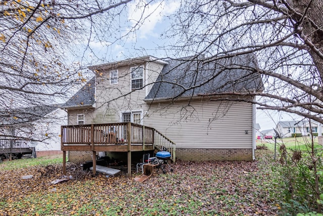 back of house with a wooden deck