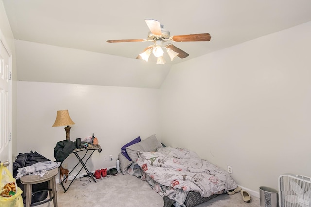 bedroom with light colored carpet, ceiling fan, and lofted ceiling