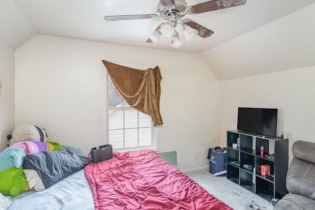 carpeted bedroom featuring ceiling fan and lofted ceiling