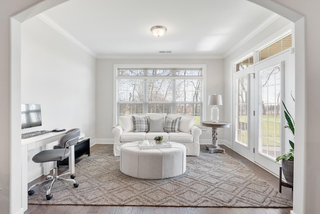 office space featuring wood-type flooring and ornamental molding