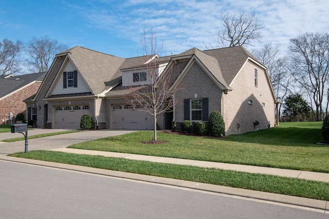 view of front of property featuring a front lawn and a garage