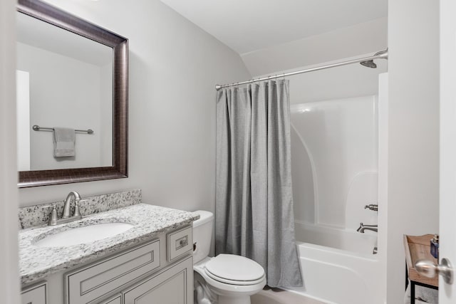 full bathroom with vanity, toilet, shower / bathtub combination with curtain, and lofted ceiling