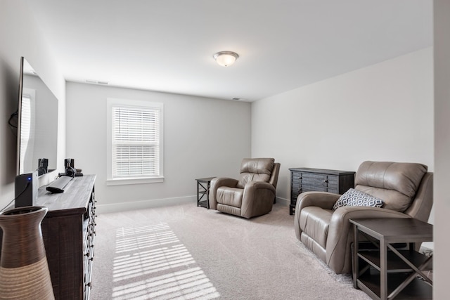 living area with light colored carpet