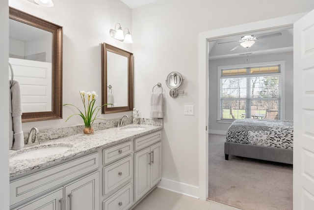 bathroom featuring vanity, tile patterned floors, and ceiling fan