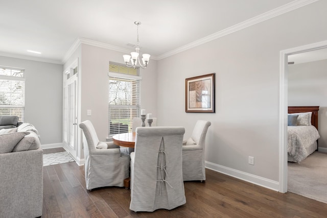 dining room with a notable chandelier, dark hardwood / wood-style floors, and ornamental molding