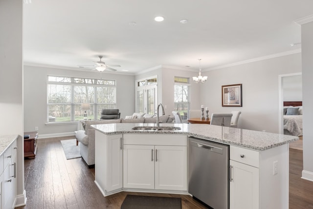 kitchen with dishwasher, white cabinets, ceiling fan with notable chandelier, sink, and decorative light fixtures