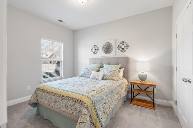 bedroom with light carpet