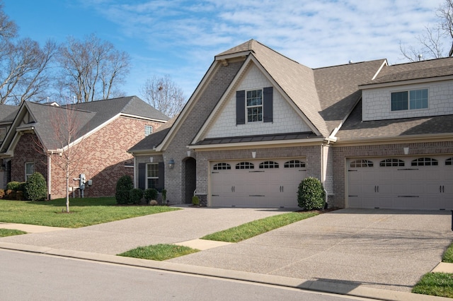 view of front of home with a garage and a front yard