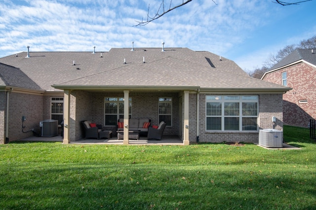 back of property featuring an outdoor hangout area, a patio, a yard, and central air condition unit