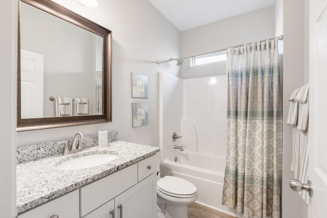 full bathroom featuring shower / tub combo, vanity, toilet, and hardwood / wood-style floors