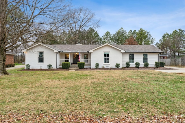 ranch-style house with covered porch and a front lawn