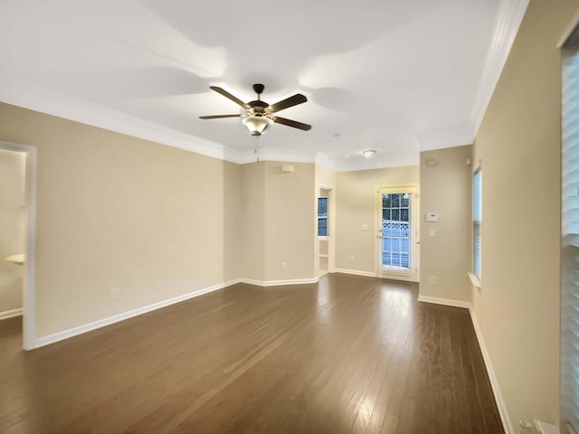 empty room featuring dark hardwood / wood-style floors, ceiling fan, and crown molding