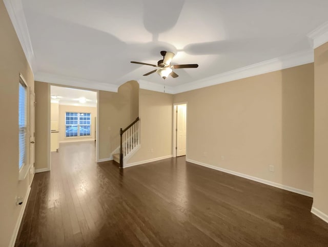 unfurnished room with ceiling fan, dark hardwood / wood-style floors, and ornamental molding