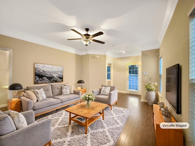 living room featuring hardwood / wood-style floors, ceiling fan, and ornamental molding