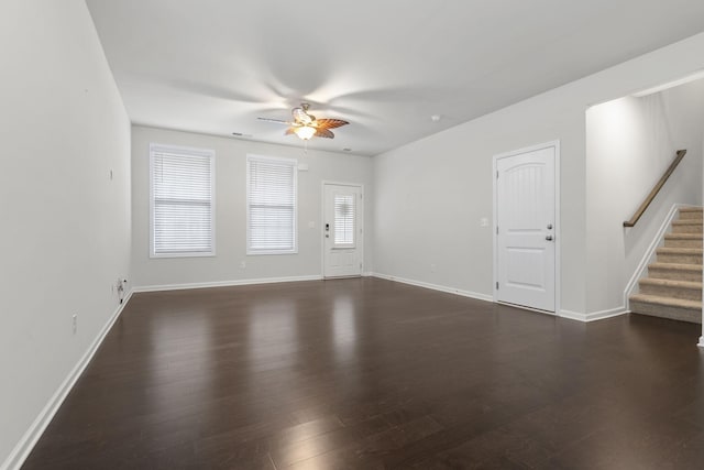 interior space featuring ceiling fan and dark hardwood / wood-style flooring