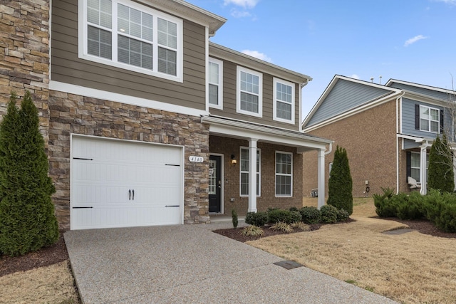 view of front of property with a porch and a garage