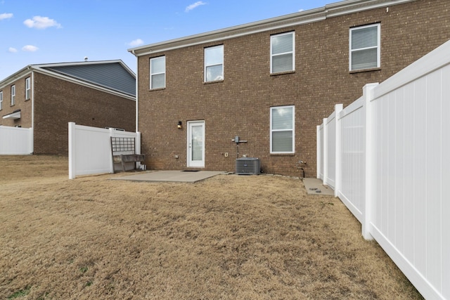 back of property featuring cooling unit and a patio area