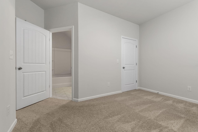 unfurnished bedroom with light colored carpet