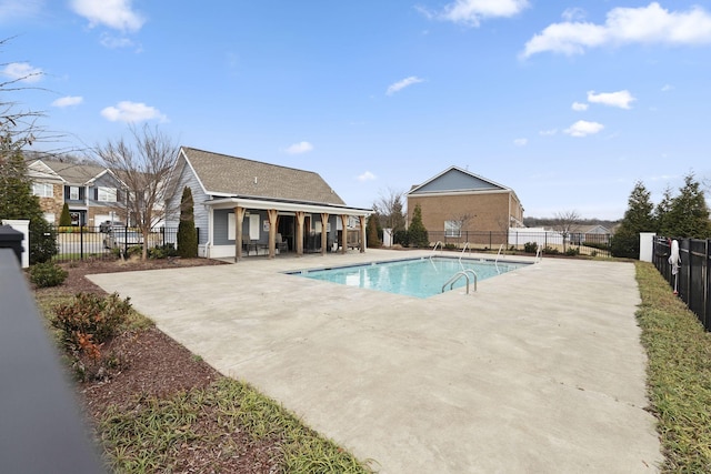 view of swimming pool featuring a patio area