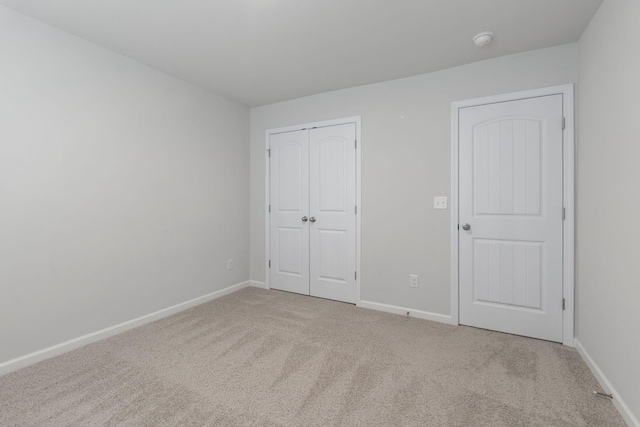 unfurnished bedroom featuring carpet