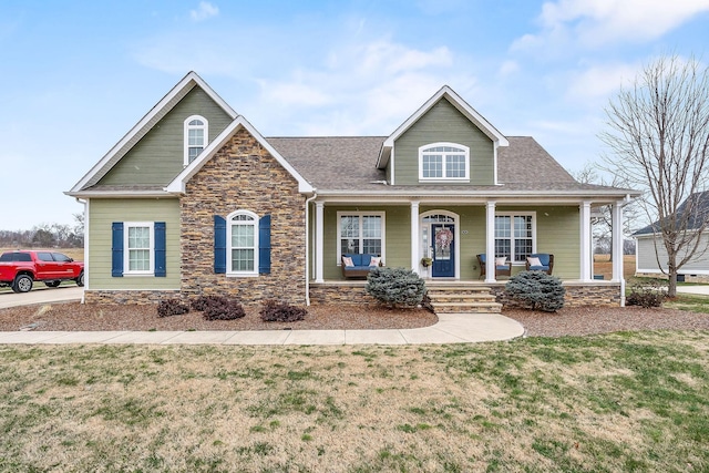 view of front of house featuring a porch and a front lawn