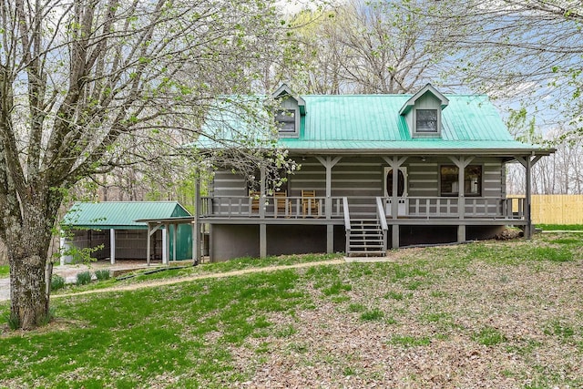 view of front of property with covered porch and a front yard