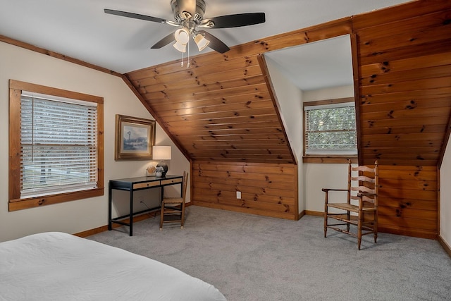 carpeted bedroom with ceiling fan and lofted ceiling