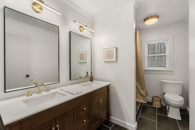 bathroom with tile patterned floors, crown molding, vanity, and toilet