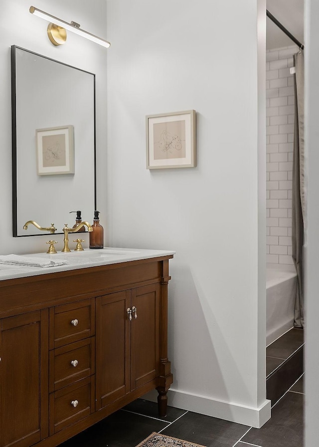 bathroom with vanity, tile patterned floors, and  shower combination