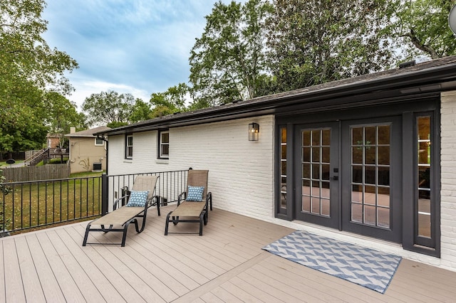 wooden deck featuring french doors