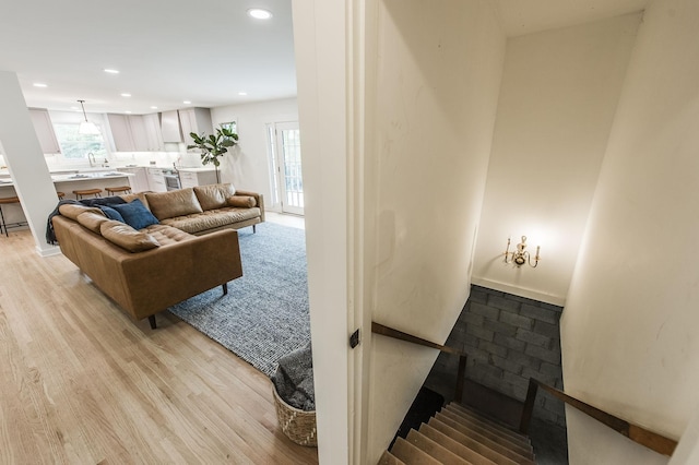 living room with light hardwood / wood-style flooring and plenty of natural light