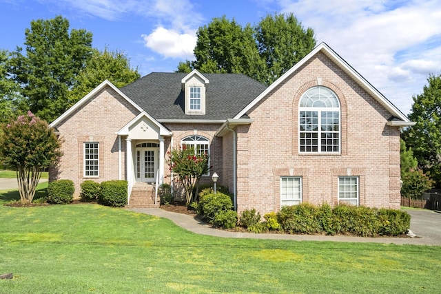 front facade featuring a front lawn