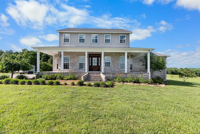 view of front facade with a front yard and a porch