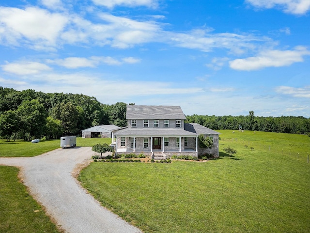 farmhouse inspired home with a front yard and a porch