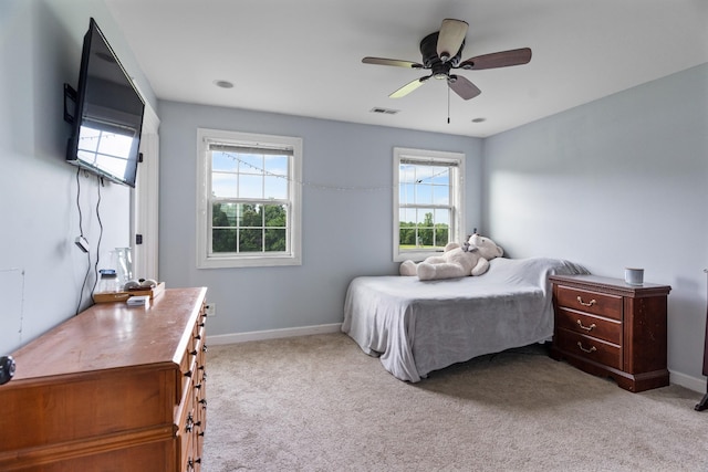 carpeted bedroom with ceiling fan