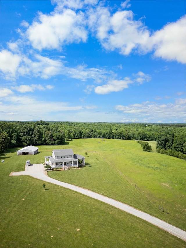 birds eye view of property with a rural view