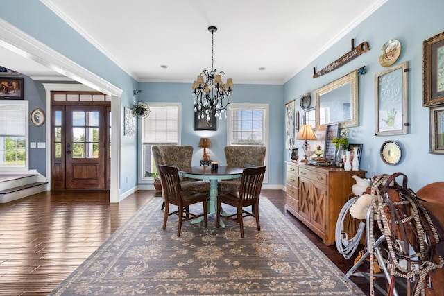 dining room featuring crown molding, dark hardwood / wood-style flooring, and a healthy amount of sunlight