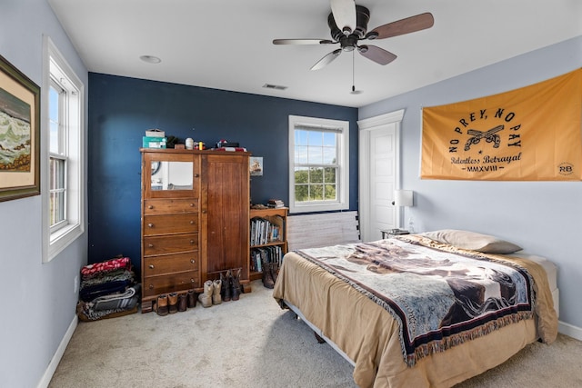 carpeted bedroom featuring ceiling fan