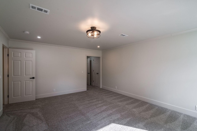 carpeted spare room featuring ornamental molding