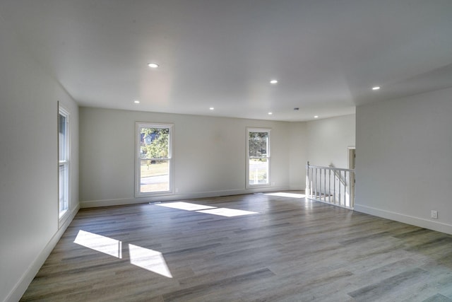 unfurnished room featuring hardwood / wood-style flooring