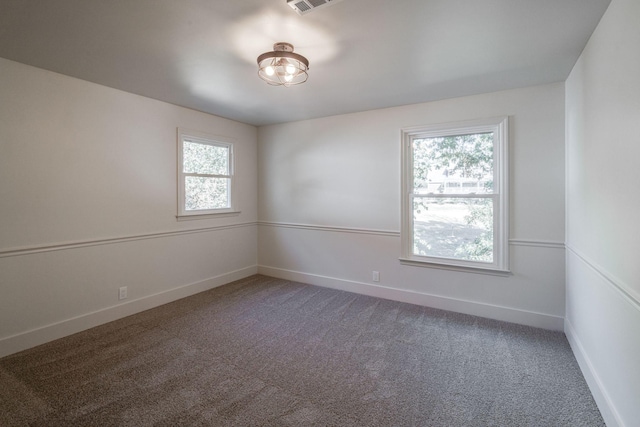 empty room with carpet flooring