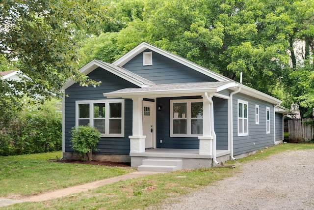 bungalow-style house featuring a front yard